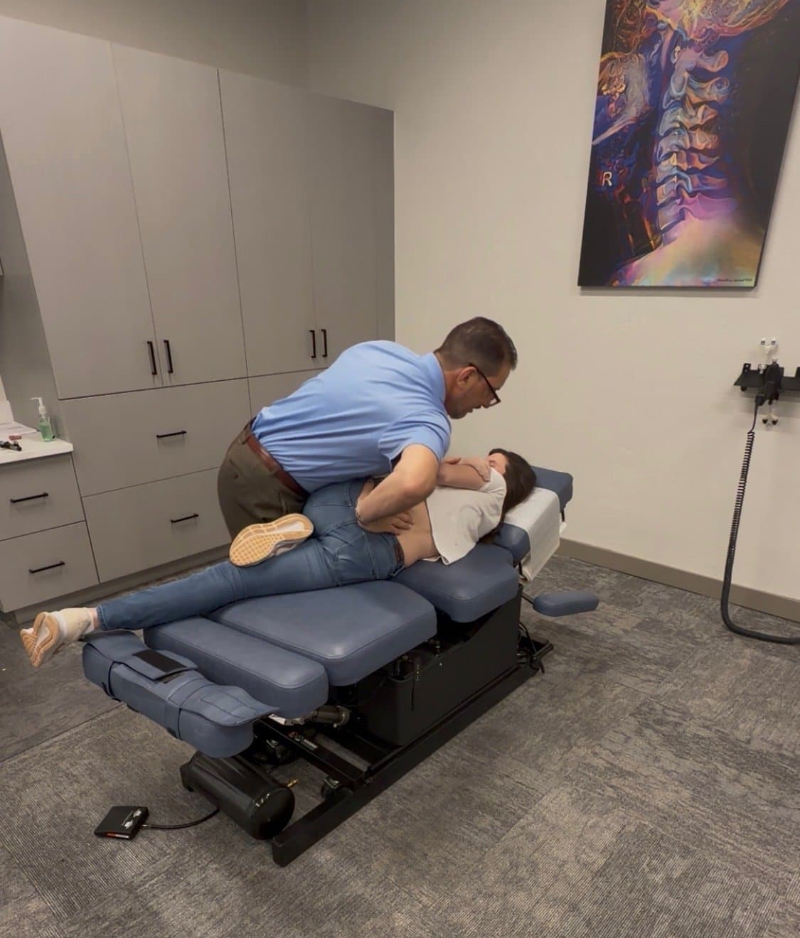 Dr. Frank performing a side-posture low back adjustment