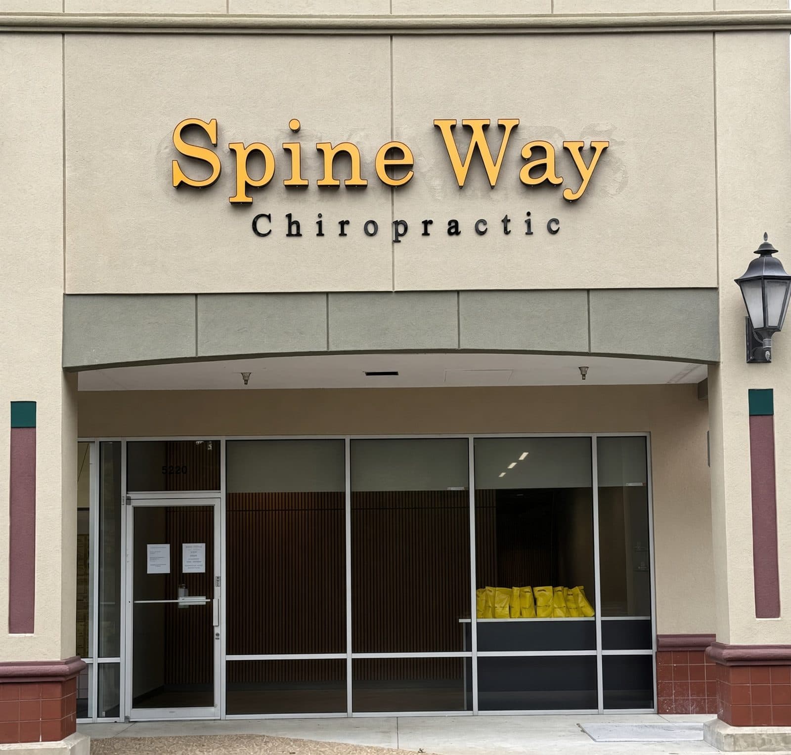 Spine Way Chiropractic storefront at 5220 W State Rd 46 in Sanford, gold letters over the front door